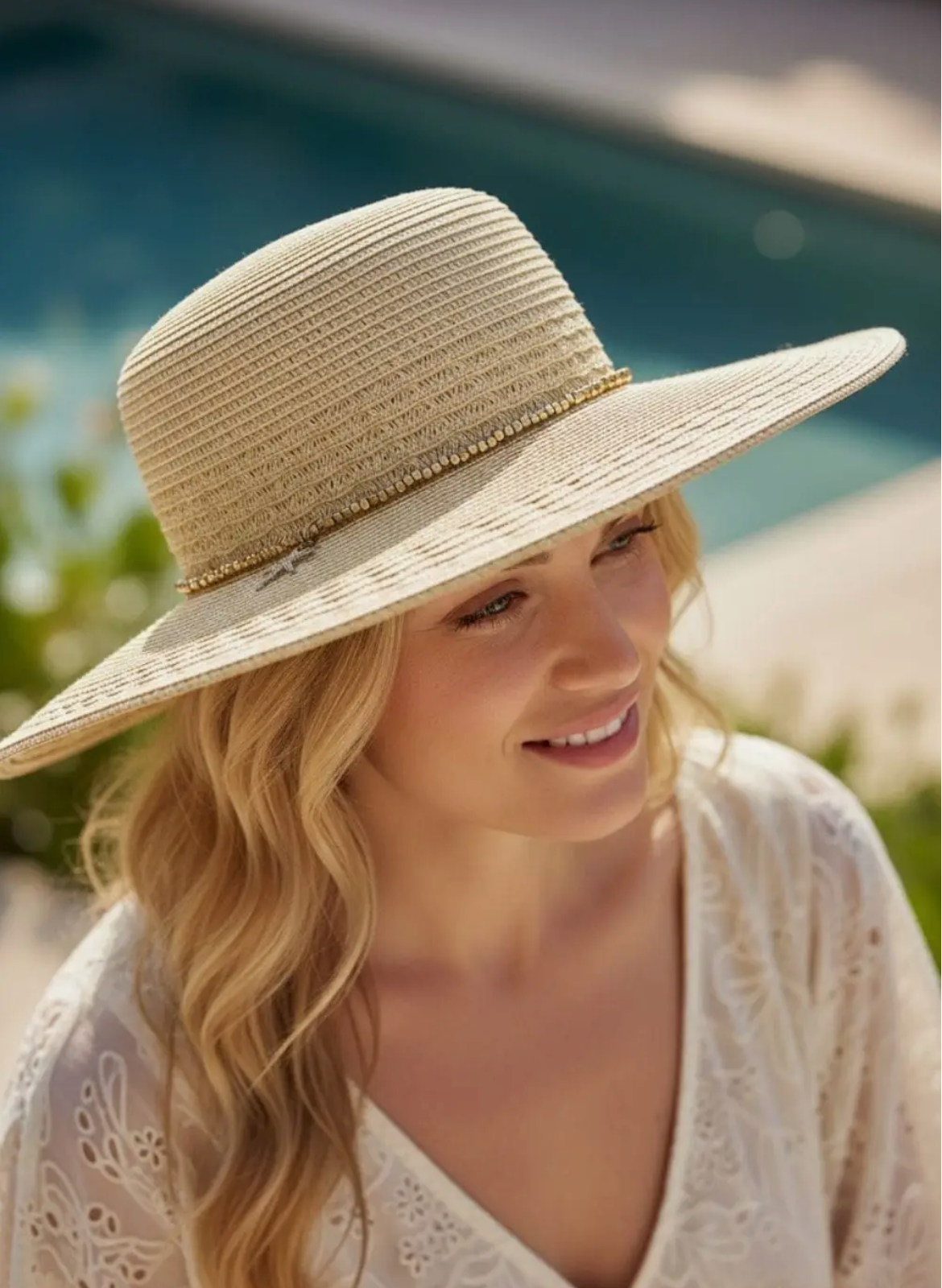 Wide Brim Straw hat with starfish sequin charm band.